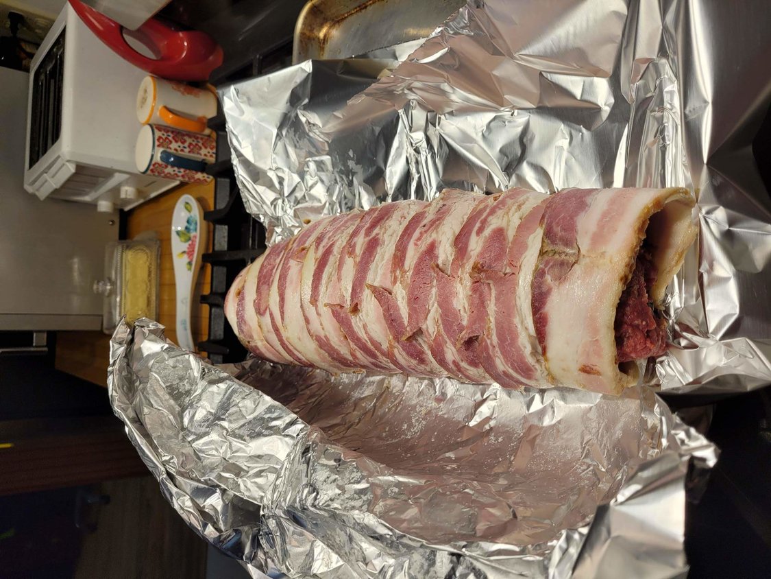 The bacon-wrapped meatloaf, heading into the oven.